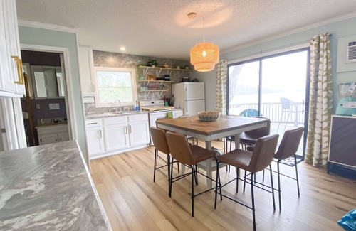 Barnett House | Lake of the Ozarks Lakefront home with water slide and game porch