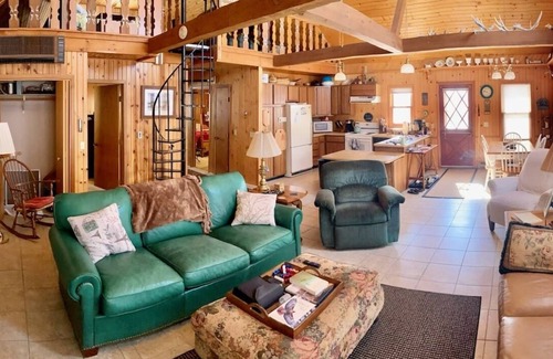 Darwin Cabin | Lake Stella beautiful beach and spacious deck on quiet private drive.