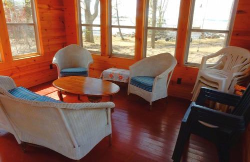Darwin Cabin | Lake Stella beautiful beach and spacious deck on quiet private drive.