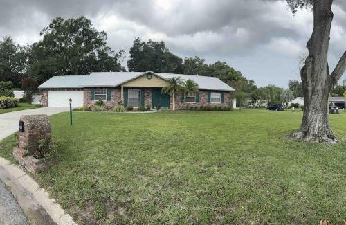 Brandon House | Lake Valrico's Camelot Court with HEATED POOL & access to private lake