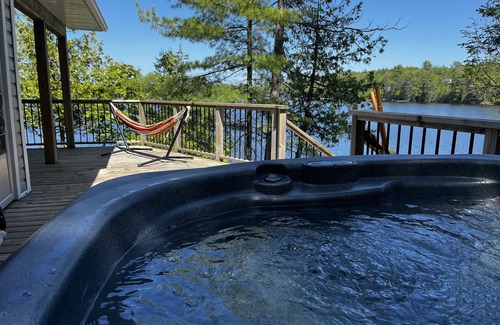 Catchacoma Cottage | Lake view cottage, clean weed free swimming and a hot tub on Mississagua Lake