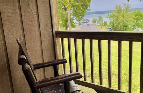 Mount Ida Apartment | Lake view queen guest room with two queens, sleeper sofa and patio overlooking Lake Ouachita. by RedAwning