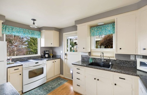 Rainier Valley House | Lake Washington View Home with Hot Tub BBQ Garden