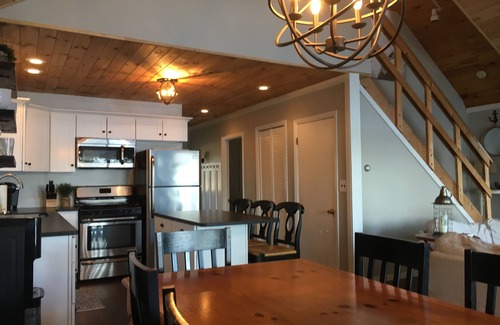 Lochmere House | Lake Winnisquam home with beach and private boat dock. 15 minutes to Gunstock.