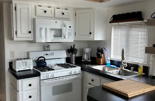 Peninsula Village Cabin | Lakefront Cabin, Boat Slip, King Bed, Seasonal Beach & Great View!