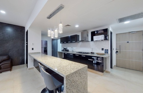Downtown Cancun Apartment | Lakefront apartment with pool, fitness room, washer/dryer, & patio