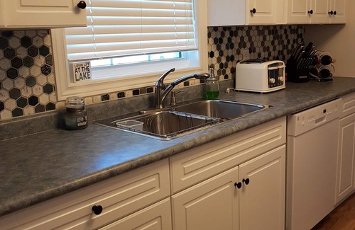 Dashwood Cottage | Lakefront Beach House w/Hot Tub, Private Sandy Beach & Stunning Sunsets
