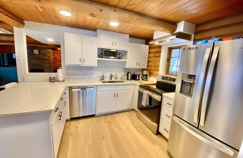 Plymouth House | Lakefront cabin with dock, hot tub, fire pit!