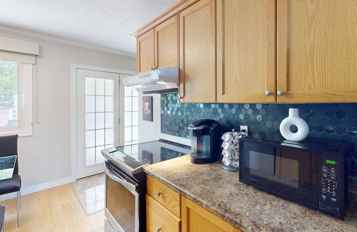 Wasaga Beach House | Lakefront condo steps to the beach with pool, and fireplace