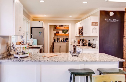 Young Harris Cottage | Lakefront cottage with private dock, hot tub, fireplace & game room