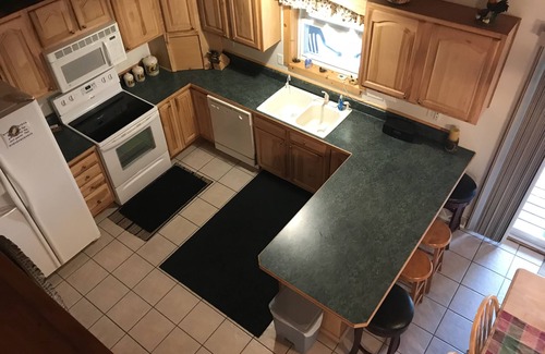 Wetmore Cottage | Lakefront, covered deck, huge backyard with grill, swimming, boat & kayaks!