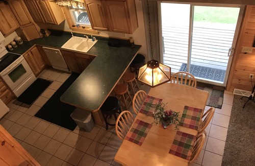 Wetmore Cottage | Lakefront, covered deck, huge backyard with grill, swimming, boat & kayaks!