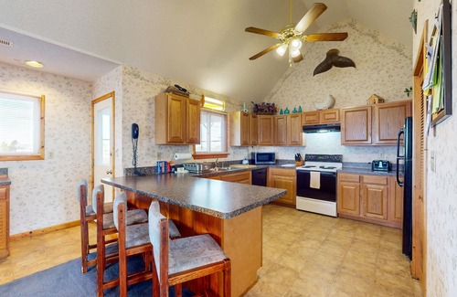 Waves House | Lakefront dog-friendly home w/private hot tub, fireplace, outdoor pool & tennis