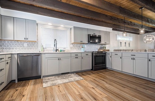 Oakland House | Lakefront, dog friendly, dock slip, hot tub, and fire pit