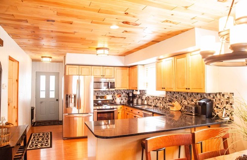 Munising House | Lakefront family getaway;large dock;private boat ramp;Pretty cottage;large deck!