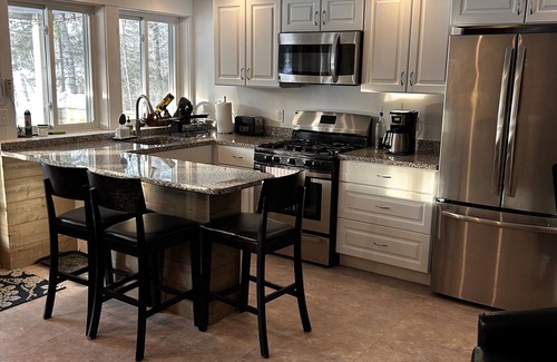 Greenville House | Lakefront family retreat close to town with hot tub, tiki bar and fire pits