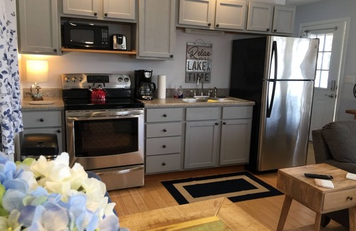 Jamestown Cabin | Lakefront, Gas Firepit. Hot Tub. Private Dock. Pup Friendly