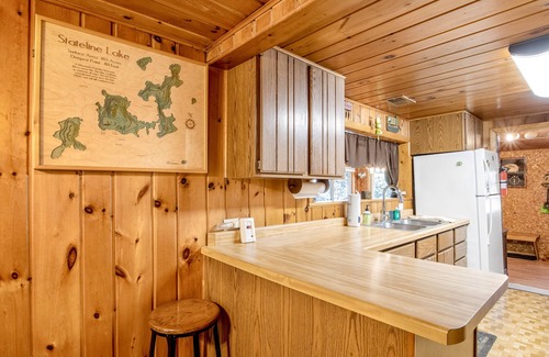 Presque Isle Cabin | Lakefront Getaway W/ Firepit, Free WiFi, Dock, & Large Deck - Dogs Welcome