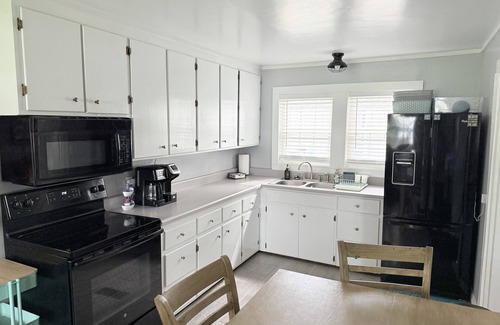 Thomas Drive House | Lakefront Home + Private Beach + Firepit + Kayaks + Pets
