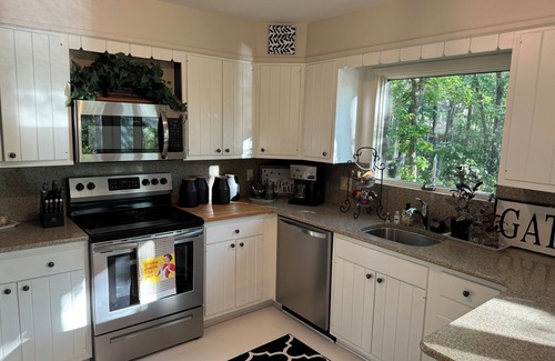 Medford House | Lakefront home in a Tree Fort like setting perched above the Spectacular Lake!