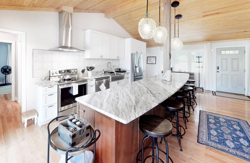 Mineral House | Lakefront home with granite counters, fireplace, lake views, & dock
