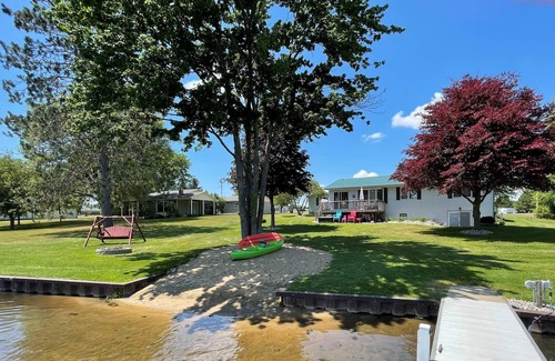 Gladwin House | Lakefront Home With Large Private Yard, Sandy Beach, Kayak and Rowboat Included.
