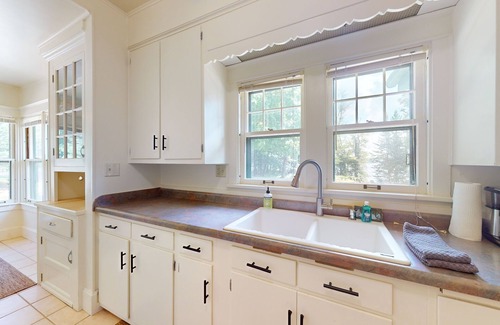 Phelps House | Lakefront home with large patio, docks, gas grill, fire pit, & WIFI