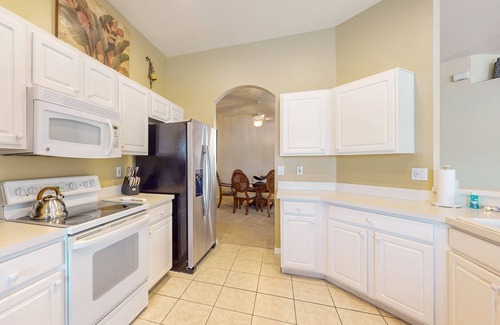 Beachwalk Isles House | Lakefront home with private heated outdoor pool, enclosed lanai, & central AC