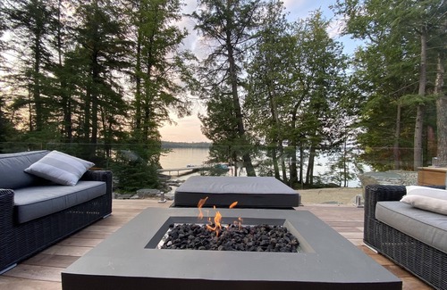 Dysart et al Cottage | Lakefront Luxury-Glass cottage, level lot, large dock, hot tub, private!
