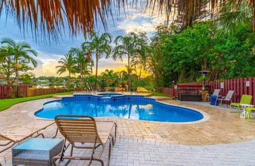 Lake Worth House | Lakefront Oasis 6BD, Sleep 14, Heated Pool, Tikis, Golf, Dock on Lake, No Stairs
