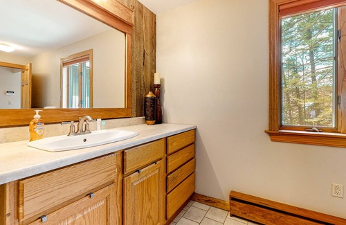 Woodstock House | Lakefront Retreat with Private Beach, Gourmet Kitchen, Game Room & Movie Space