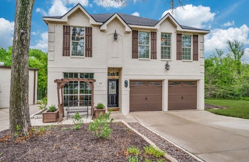 Little Elm House | Lakefront retreat just steps from Lake Lewisville! Enjoy 341 ft of shoreline, a private cove, sandy beach, fire pit, and pergola with built-in grill. Inside: lake views, travertine floors, cozy fireplace, and an upstairs game room with balcony.