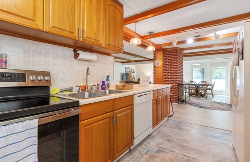 Ingles House | Lakefront retreat with private dock, open living, fire pit, full kitchen & cozy indoor spaces