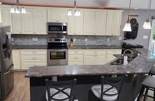 Littleton House | Lakefront single-story home, Flat lot! Huge game room!