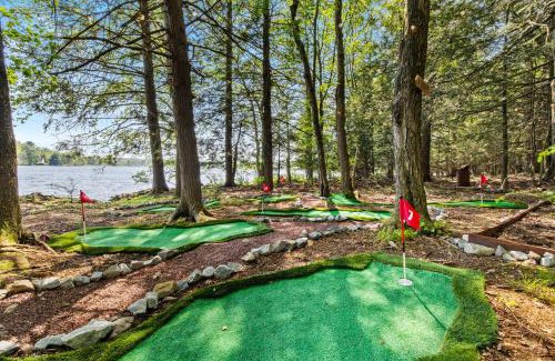 Pocono Summit Ski Chalet | Lakehouse with Boats, MiniGolf, Sauna, HotTub, Swings and Playground!