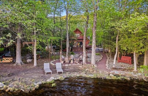Pocono Summit Ski Chalet | Lakehouse with Boats, MiniGolf, Sauna, HotTub, Swings and Playground!