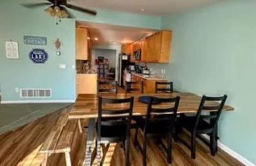 Sand Creek House | Lakeside Beach Getaway with A Gorgeous Kitchen & Dining Room with Room for 10.