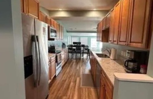 Sand Creek House | Lakeside Beach Getaway with A Gorgeous Kitchen & Dining Room with Room for 10.