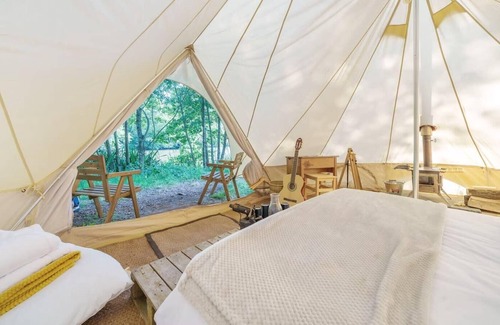 Nunney RV Rental | Lakeside Bell Tent - Canvas Suite at Marston Park