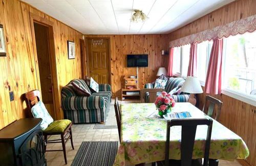 Lakefield Ski Chalet | Lakeside Cottage for 8 with Boat Firepit and BBQ