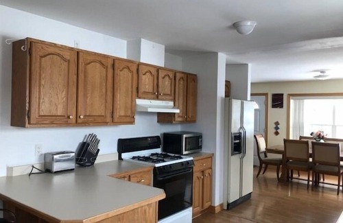 Presque Isle House | Lakeside Luxury, 4 bedrooms, 2 bath, sleeps 10. Outdoor Grill, Kayaks, Firepit.