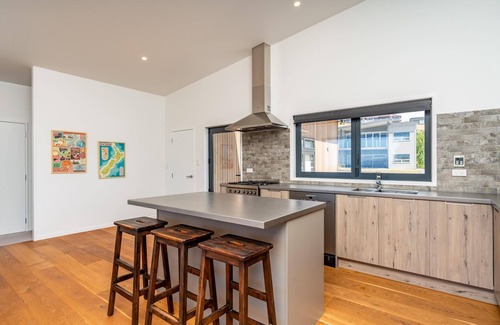 Langs Beach House | Langs Beach House - Modern, sunny holiday home with large decks and stunning views over Bream Bay