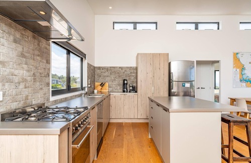 Langs Beach House | Langs Beach House - Modern, sunny holiday home with large decks and stunning views over Bream Bay