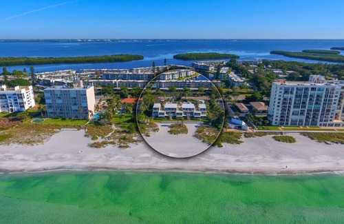 Longboat Key Apartment | LaPlaya 202E Catch the gentle Gulf breezes on your private balcony beneath the swaying palms