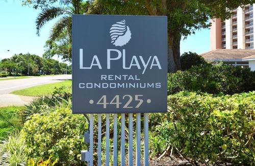 Longboat Key Apartment | LaPlaya 202E Catch the gentle Gulf breezes on your private balcony beneath the swaying palms