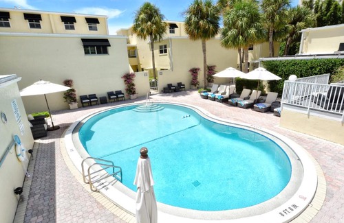 Longboat Key Apartment | LaPlaya 202E Catch the gentle Gulf breezes on your private balcony beneath the swaying palms