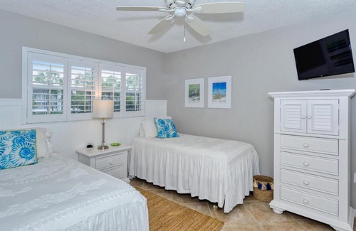 Longboat Key Apartment | LaPlaya 202E Catch the gentle Gulf breezes on your private balcony beneath the swaying palms