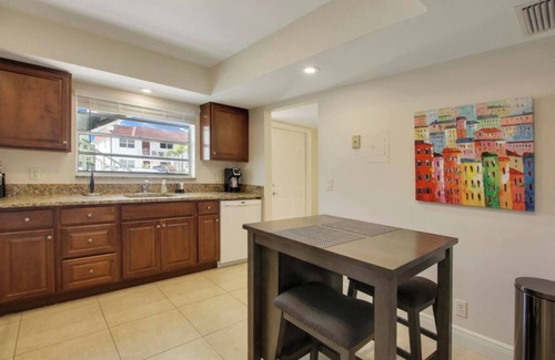 Palm Beach Shores Apartment | Large 2 Bed 2 Bath, King Beds, Screened Patio, Smart TV's in each room!