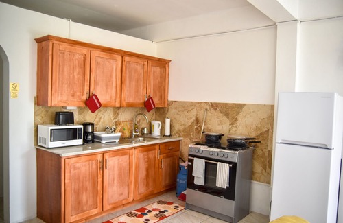 Castle Comfort Apartment | Large 2 Bedroom 2 Bathroom Apartment #4 in Roseau. Bus stops right in front!