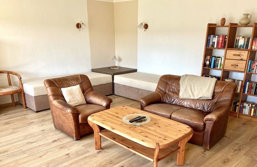 Woltersdorf Apartment | Large apartment with garden, barbecue area, rowing boat, jetty, SUP boards